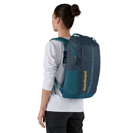 Patagonia Black Hole Pack 25L in Tidal Teal w/Luminous Pink worn on model