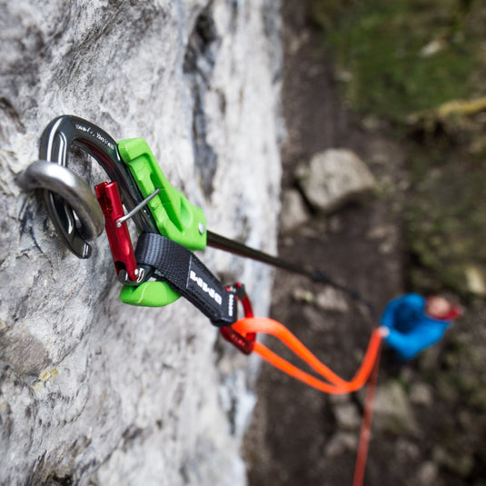 Beta evo clipstick showing how it is used with rope and quickdraw attached clipping to bolt outside