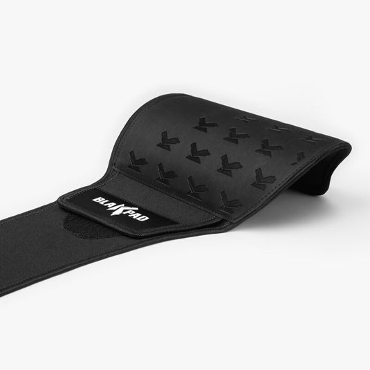 Blakpad VS kneepad laid out on white surface