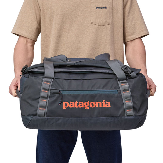 Black Hole Duffel 40L in black being carried by model