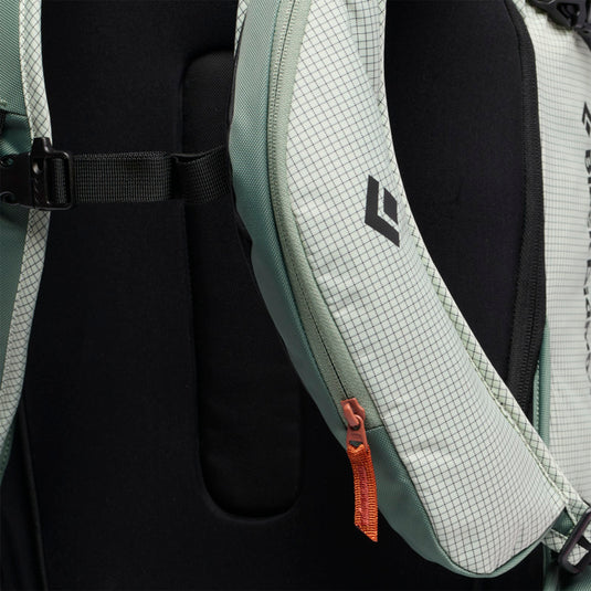 Black Diamond Dawn Patrol 25 Backpack in foam green showing zippered shoulder pockets