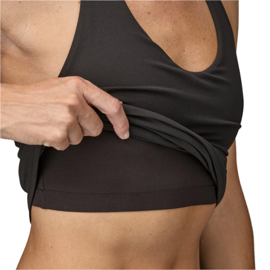 Women's Maipo Tank Top in black worn by model, showing built in bra