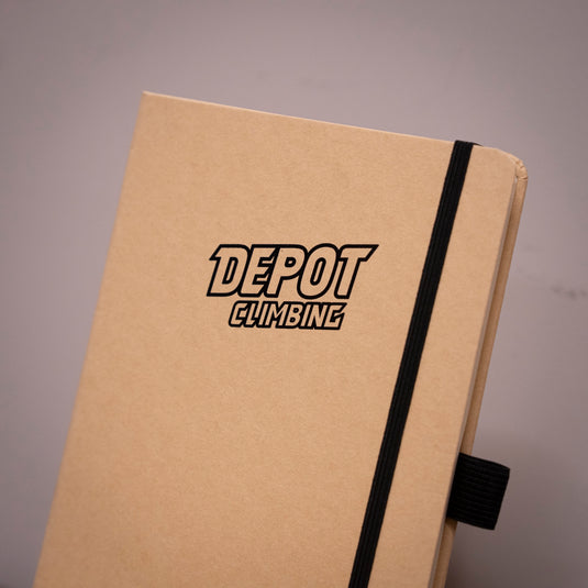 A5 Depot Climbing Note Book on wooden surface