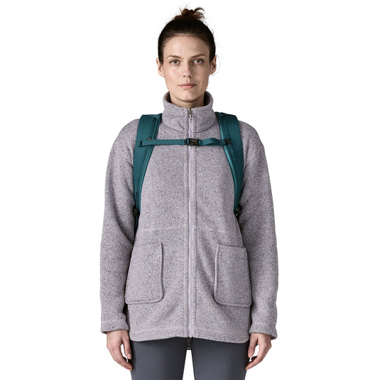 Patagonia Black Hole Pack 32L in Teal on models back