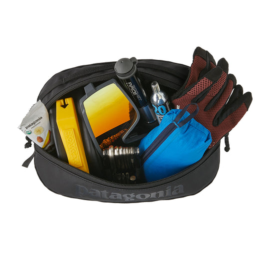Patagonia Black Hole Cube 3L showing internal pocket filled with various items