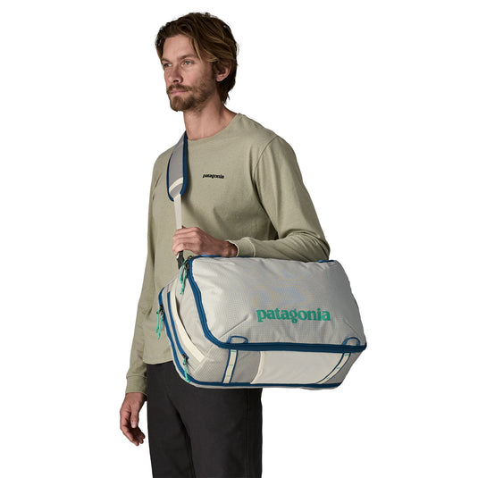 Patagonia Black Hole Mini MLC - 30L in Birch White on shoulder of model