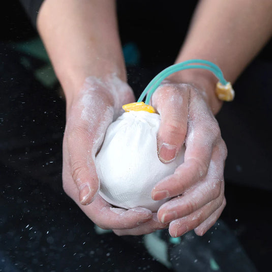 Midnight Lightning Refillable Chalk Sock  being used in chalky hands